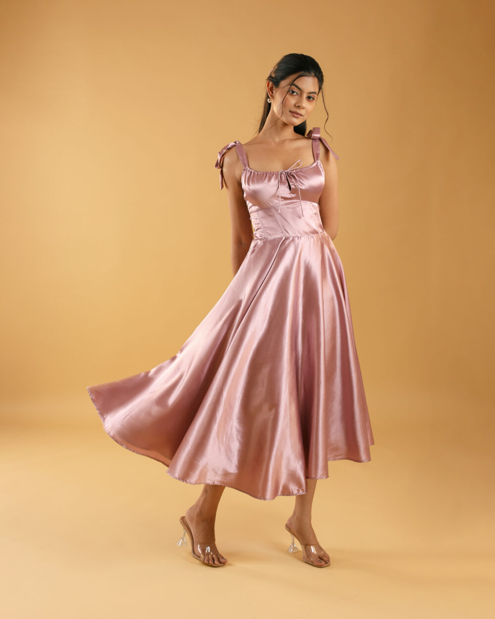 Dusty Rose satin midi dress with flared hem and tie-up shoulder straps, designed for party wear and college events