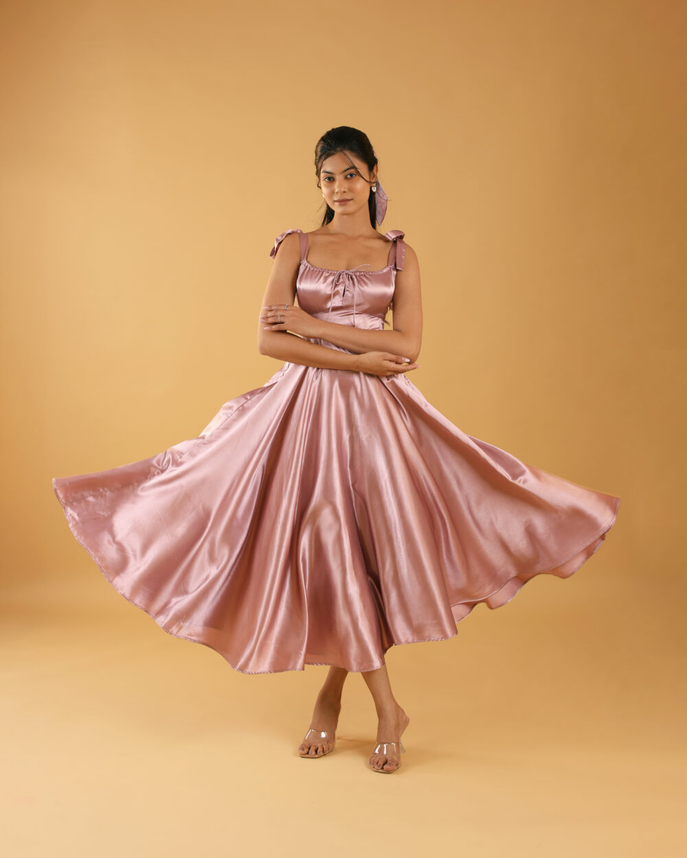 Dusty Rose satin midi dress with flared hem and tie-up shoulder straps, designed for party wear and college events