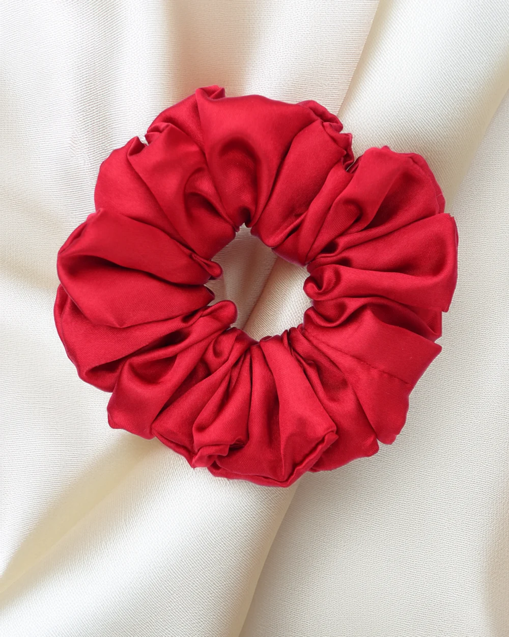 alt="Red satin hair scrunchies with bow – soft and elegant hair accessory for women"