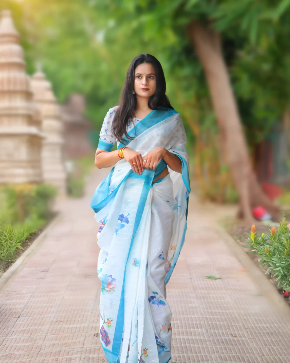 alt="White printed cotton saree for women with blue border – ideal for office, nurse, and school teacher wear"