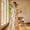 Women’s white floral maxi dress with yellow flower print and puff sleeves